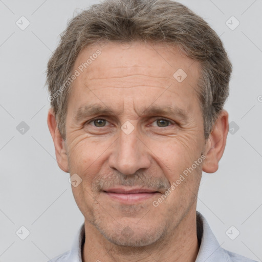 Joyful white middle-aged male with short  brown hair and brown eyes