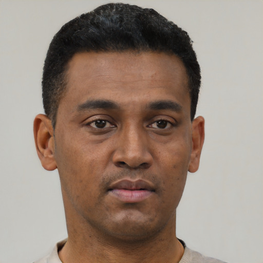 Neutral black young-adult male with short  black hair and brown eyes