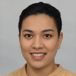 Joyful asian young-adult female with short  black hair and brown eyes