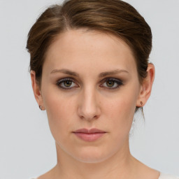 Neutral white young-adult female with short  brown hair and grey eyes