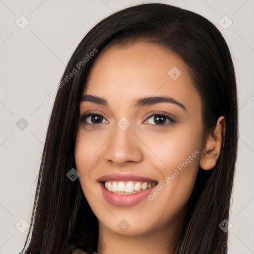 Joyful latino young-adult female with long  black hair and brown eyes