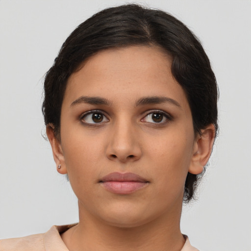 Neutral latino young-adult female with short  brown hair and brown eyes