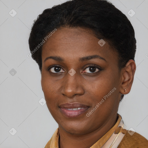 Joyful black young-adult female with short  brown hair and brown eyes