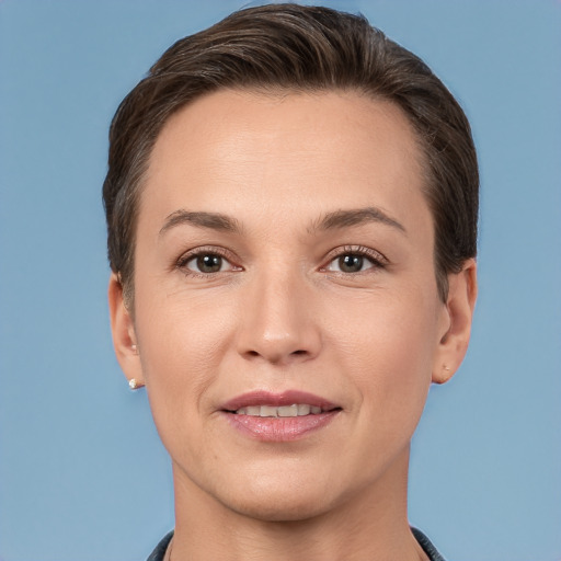 Joyful white adult female with short  brown hair and brown eyes