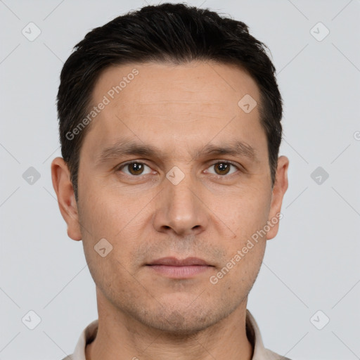 Joyful white adult male with short  brown hair and brown eyes