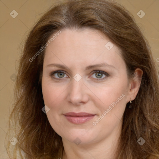 Joyful white young-adult female with long  brown hair and green eyes