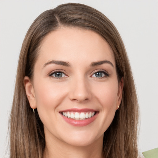 Joyful white young-adult female with long  brown hair and grey eyes