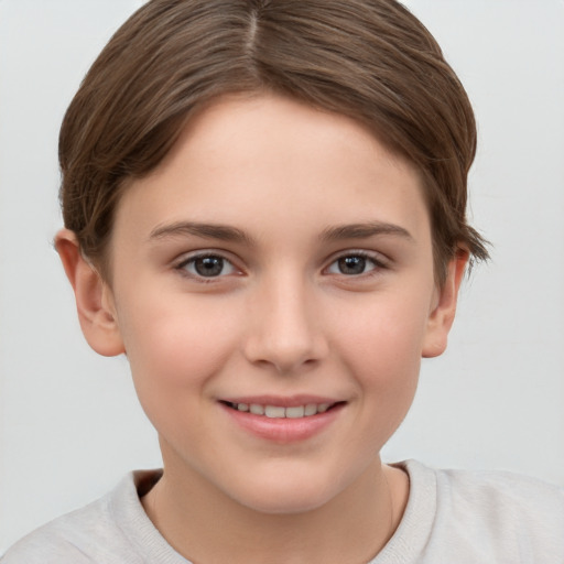 Joyful white child female with short  brown hair and brown eyes