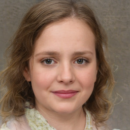 Joyful white young-adult female with medium  brown hair and green eyes