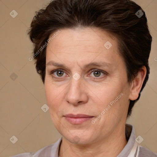 Joyful white adult female with short  brown hair and brown eyes