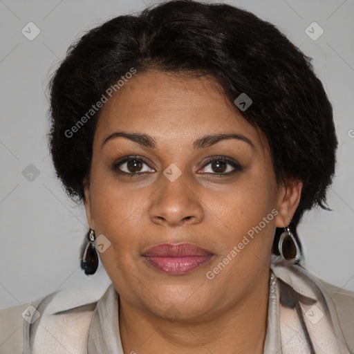 Joyful black adult female with medium  brown hair and brown eyes