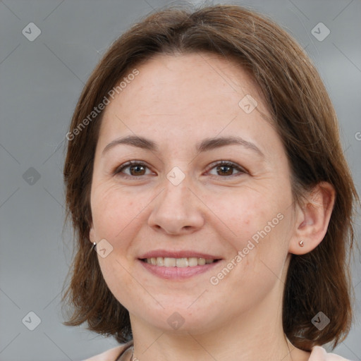 Joyful white adult female with medium  brown hair and brown eyes