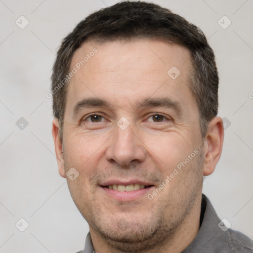 Joyful white adult male with short  brown hair and brown eyes