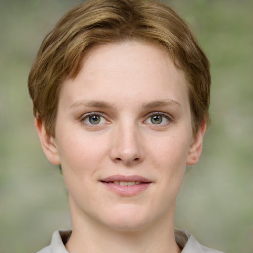 Joyful white young-adult female with medium  brown hair and green eyes