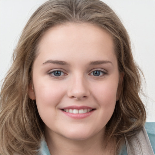 Joyful white child female with long  brown hair and grey eyes