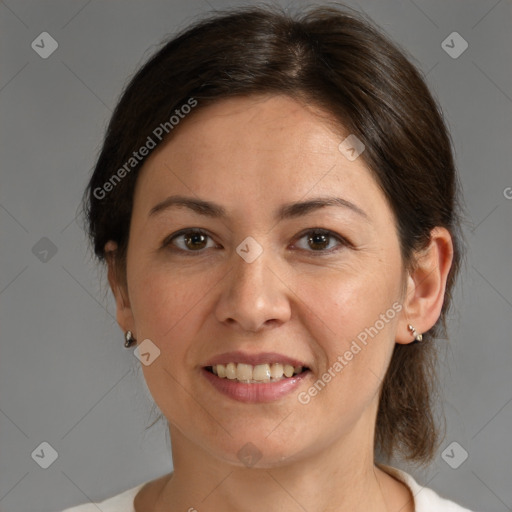 Joyful white adult female with medium  brown hair and brown eyes