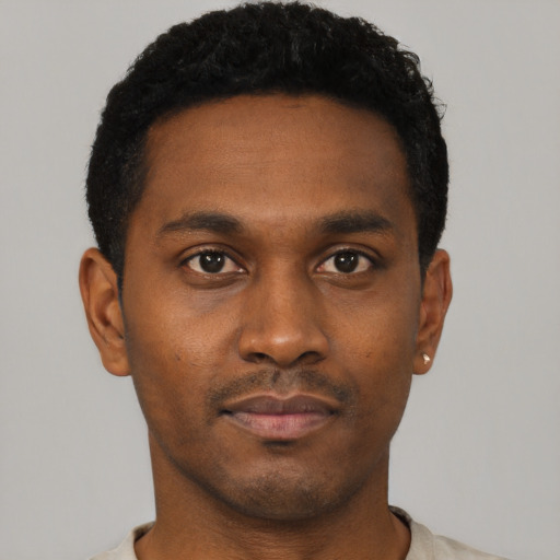 Neutral black young-adult male with short  black hair and brown eyes