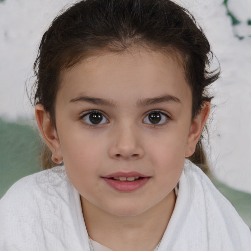 Joyful white child female with short  brown hair and brown eyes