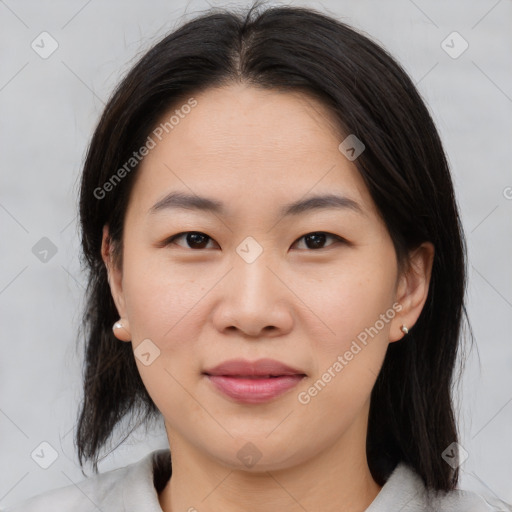 Joyful asian young-adult female with medium  brown hair and brown eyes