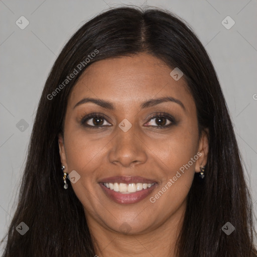 Joyful black young-adult female with long  brown hair and brown eyes