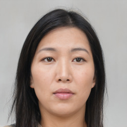 Neutral asian young-adult female with medium  brown hair and brown eyes