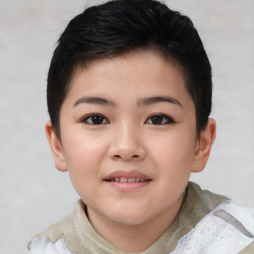 Joyful asian child female with short  brown hair and brown eyes