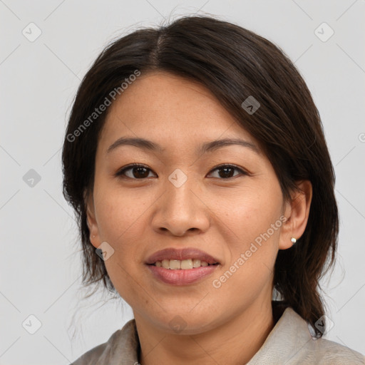 Joyful asian young-adult female with medium  brown hair and brown eyes