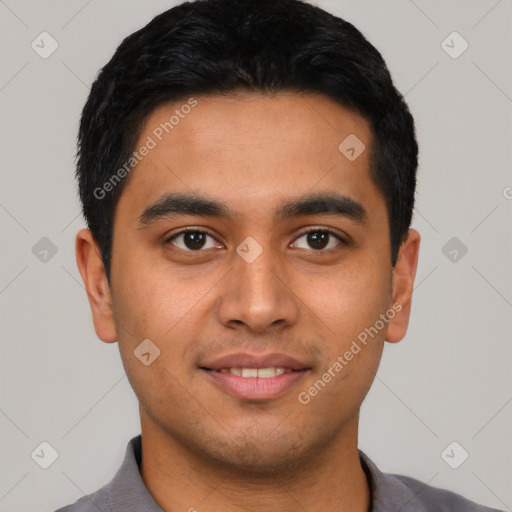 Joyful latino young-adult male with short  black hair and brown eyes