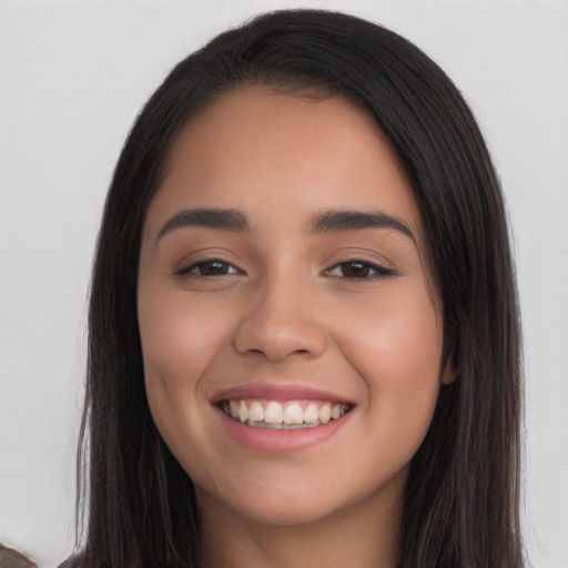 Joyful white young-adult female with long  black hair and brown eyes