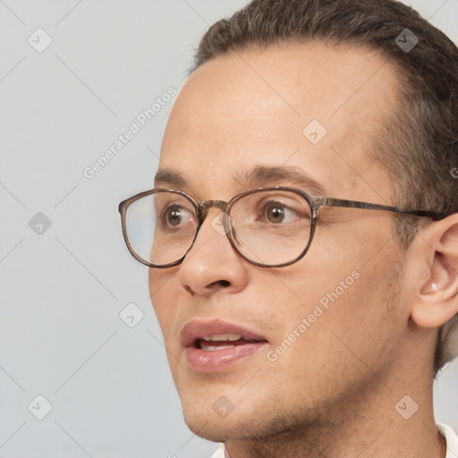 Joyful white adult male with short  brown hair and brown eyes