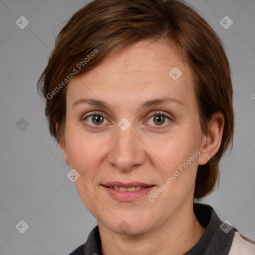 Joyful white adult female with medium  brown hair and grey eyes