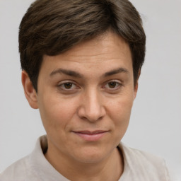 Joyful white adult female with short  brown hair and brown eyes