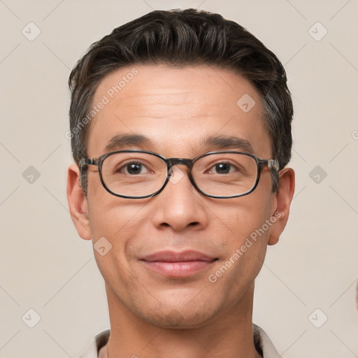 Joyful white adult male with short  brown hair and brown eyes