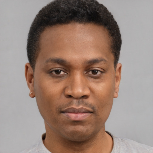 Neutral black young-adult male with short  black hair and brown eyes