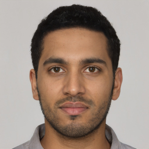Neutral latino young-adult male with short  black hair and brown eyes