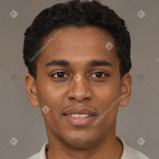 Joyful black young-adult male with short  brown hair and brown eyes