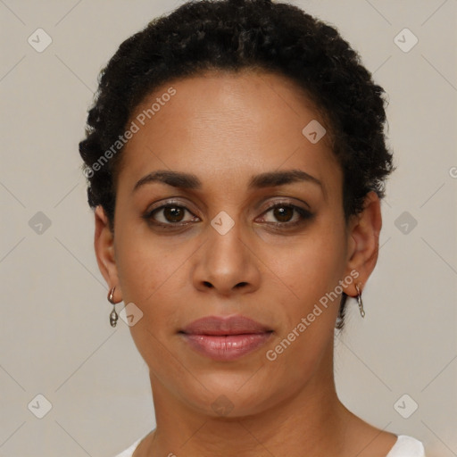 Joyful black young-adult female with short  brown hair and brown eyes