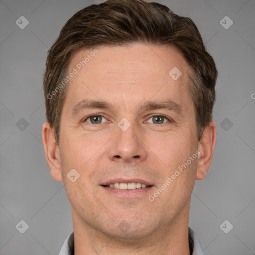 Joyful white adult male with short  brown hair and grey eyes