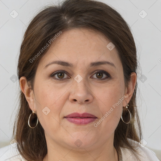 Joyful white adult female with medium  brown hair and brown eyes