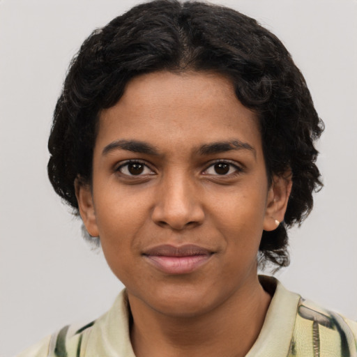 Joyful latino young-adult female with short  black hair and brown eyes