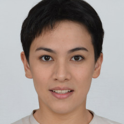 Joyful asian young-adult female with short  brown hair and brown eyes