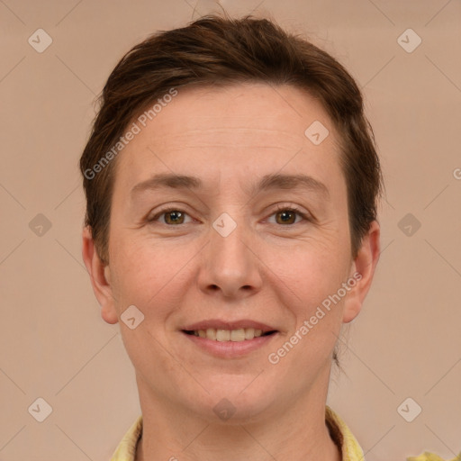 Joyful white adult female with short  brown hair and grey eyes