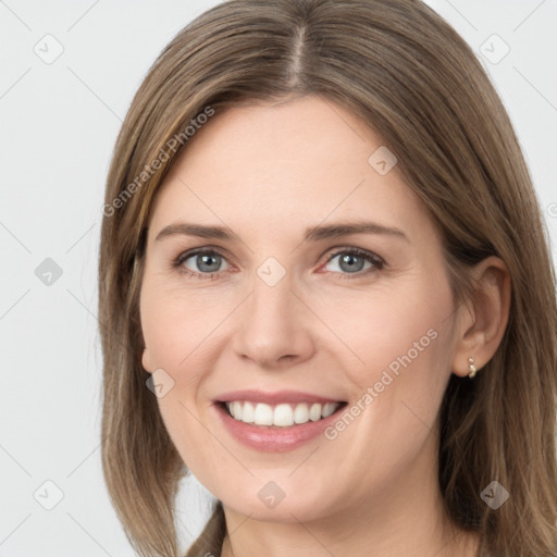 Joyful white young-adult female with long  brown hair and grey eyes