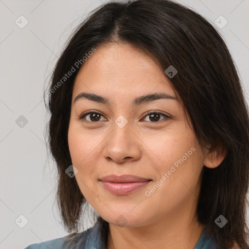 Joyful asian young-adult female with long  brown hair and brown eyes