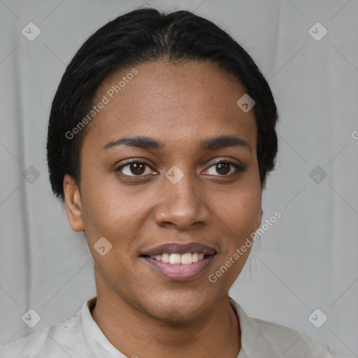 Joyful black young-adult female with short  black hair and brown eyes