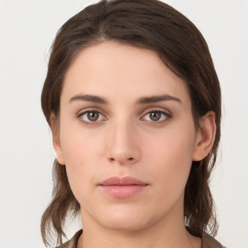 Neutral white young-adult female with medium  brown hair and brown eyes