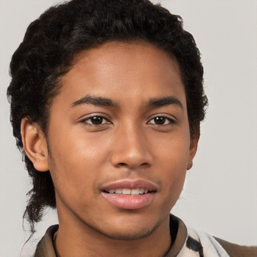 Joyful latino young-adult male with short  brown hair and brown eyes