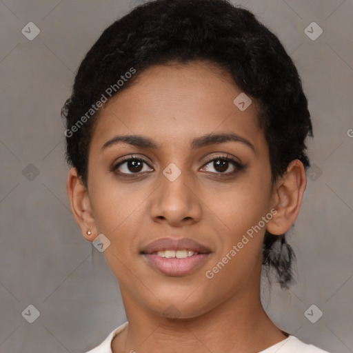 Joyful latino young-adult female with short  black hair and brown eyes