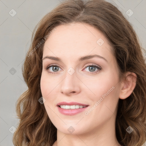 Joyful white young-adult female with medium  brown hair and green eyes