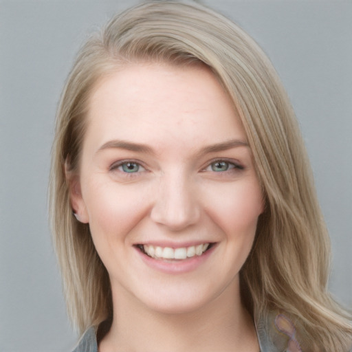 Joyful white young-adult female with medium  brown hair and blue eyes